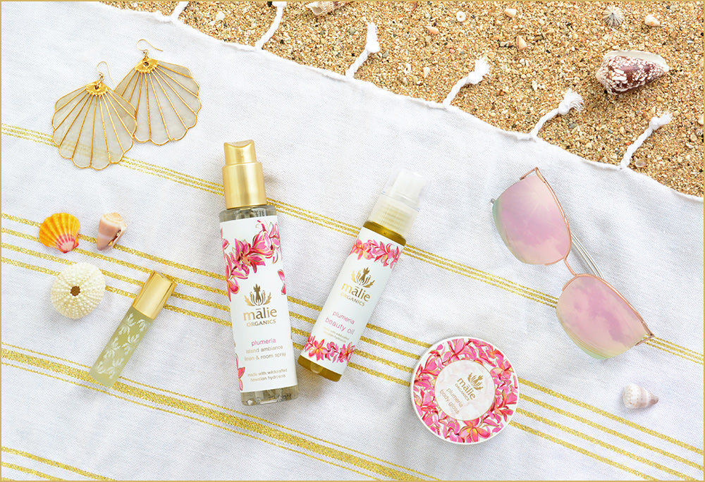 Collection of organic plumeria beauty products from paradise